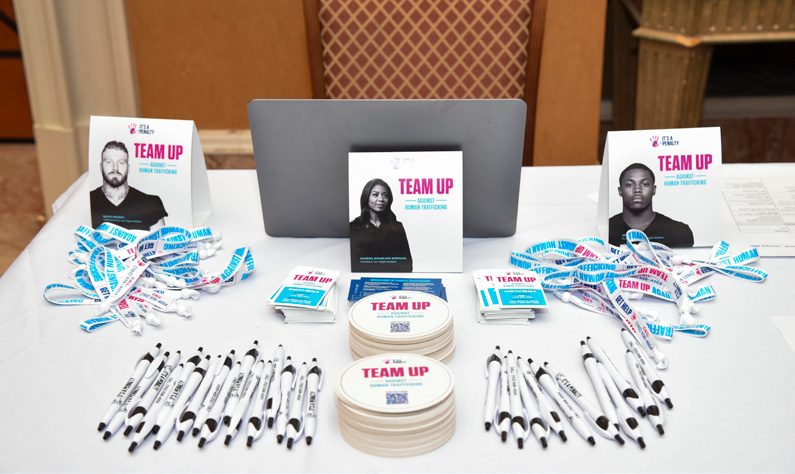 Event table with branded coasters, wristbands and cards